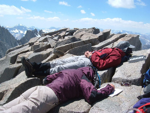 Enthusiastic climbers celebrate atop Mt. Sill